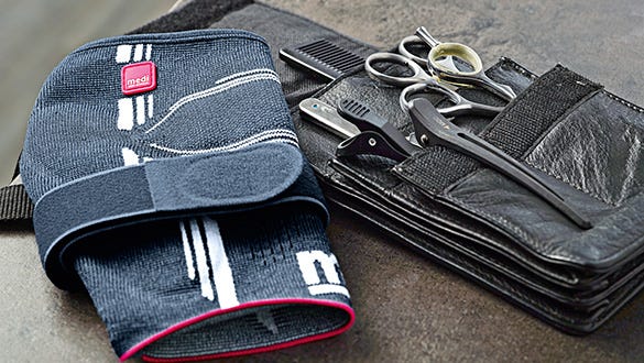 image shot of a medi epicomed  elbow siuppport next to a leather beauty bag