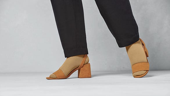 female foot wearing compression stockings to support the lymphatic vessel system