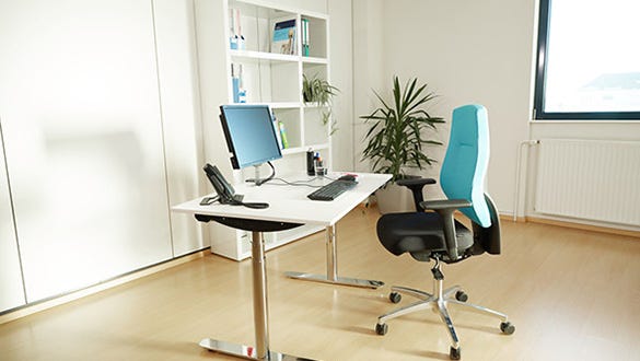 ergonomic workplace and furniture set up to prevent back and neck pain and encourage dynamic sitting