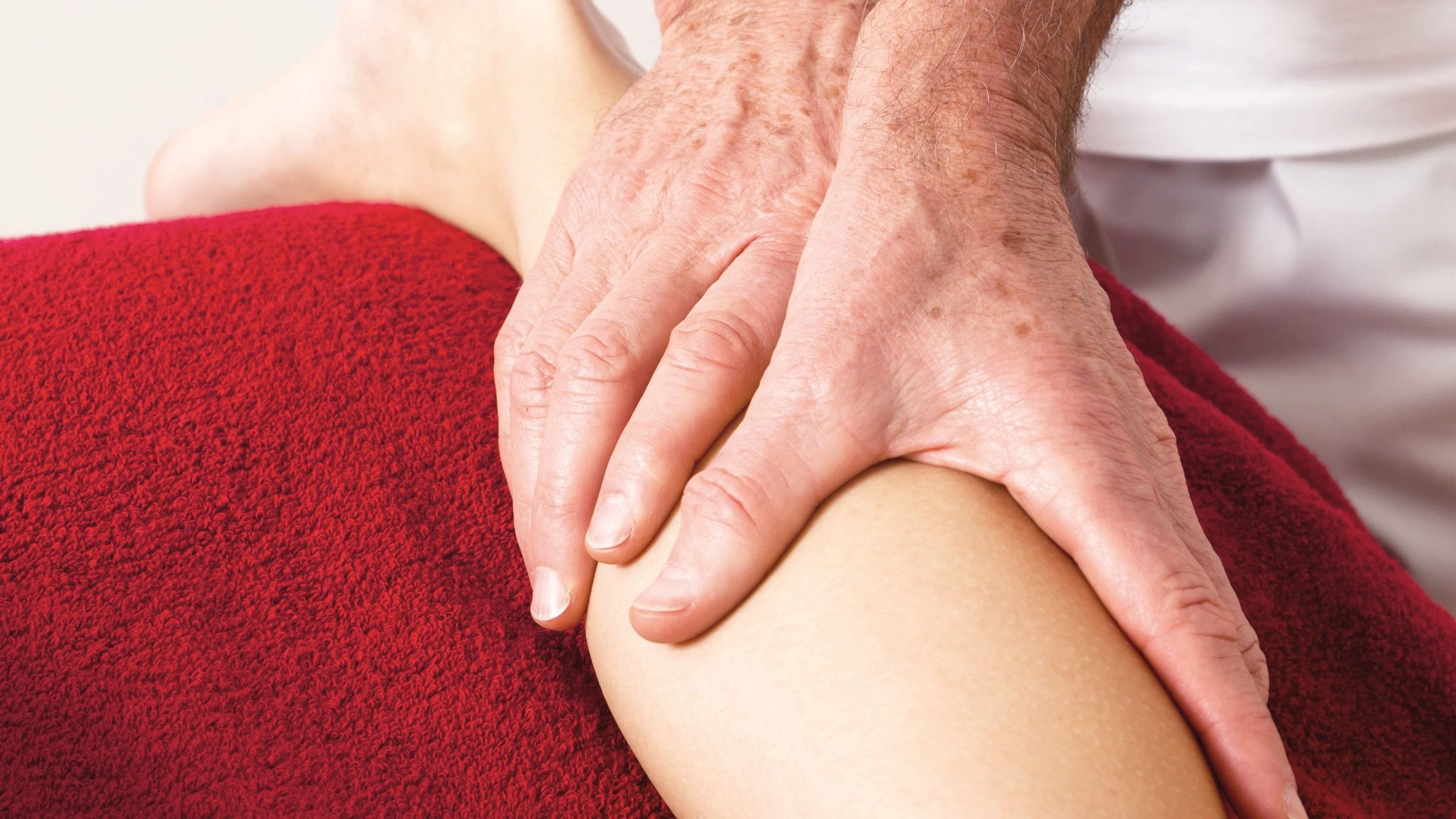 Patient receives manual lymph drainage on the leg