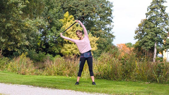 "Woman doing outside back strengthening exercises  while shwcasing her lumbamed back support