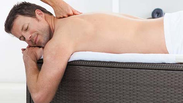 men taking care of his skin and enjoying  a relaxing upper back massage