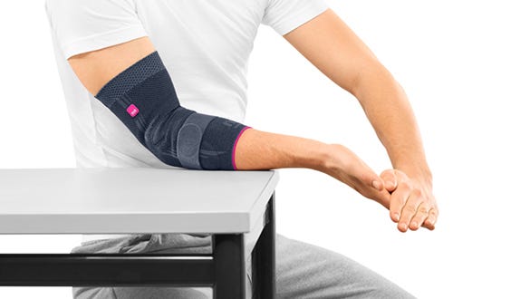 picture explanation  of the first step of a strenghtening elbow  exercise 
